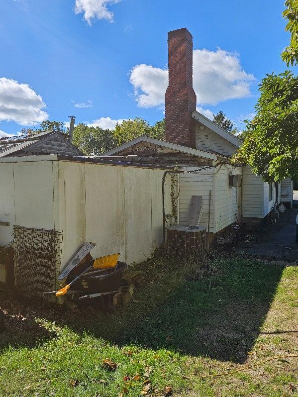 view of property exterior with central AC unit