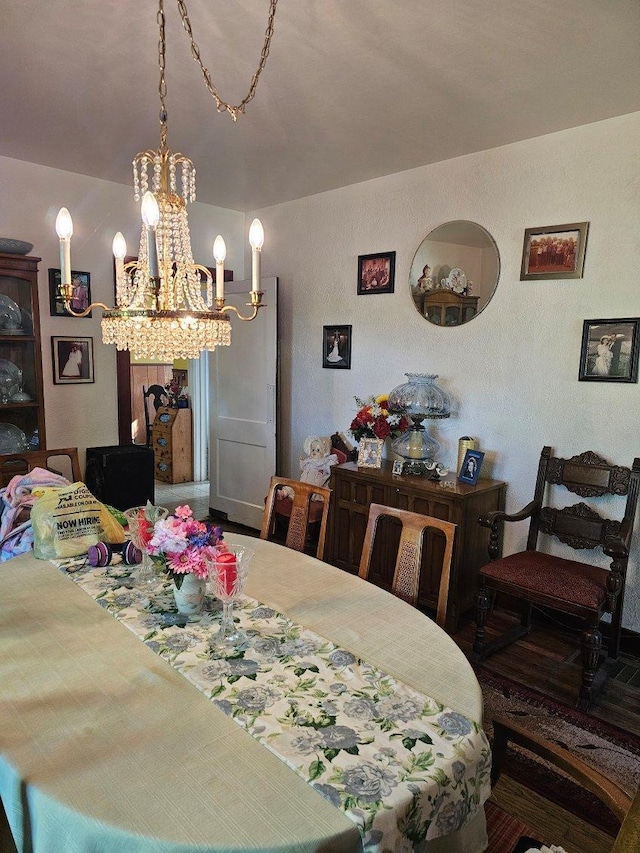 dining area with an inviting chandelier