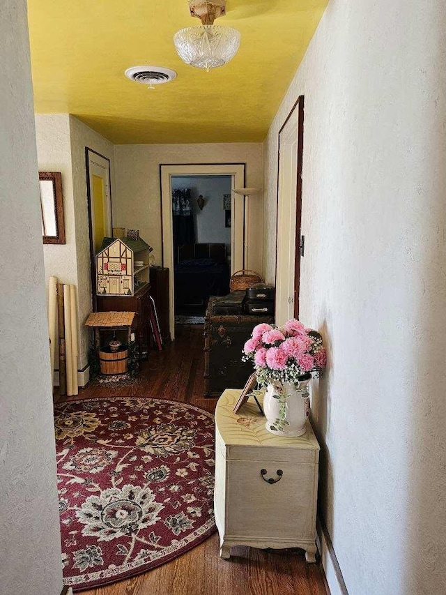 corridor with dark wood-type flooring