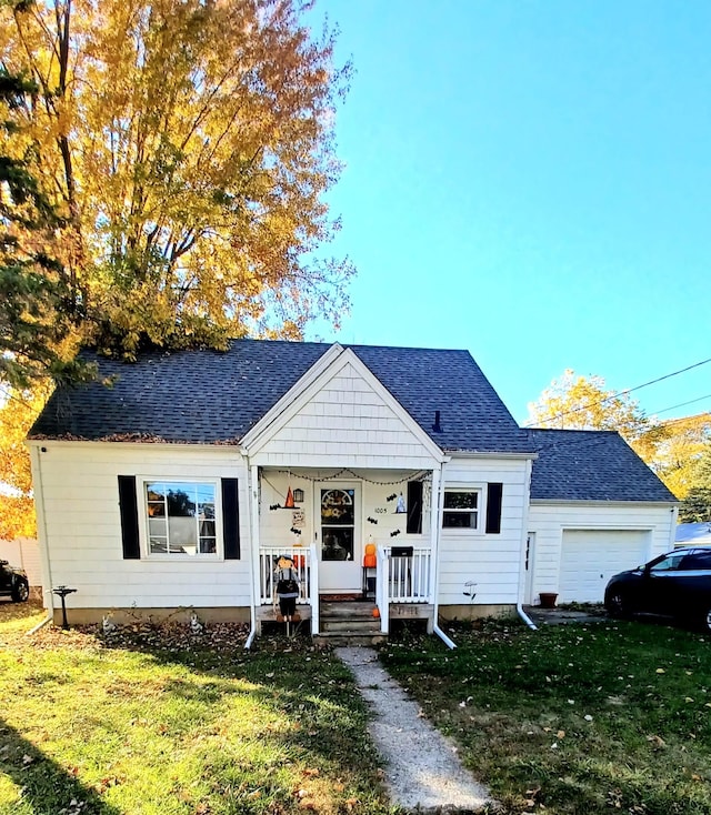 view of front facade featuring covered porch, a garage, and a front yard