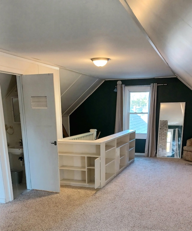 additional living space with carpet and lofted ceiling