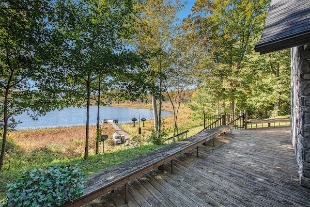 wooden deck with a water view