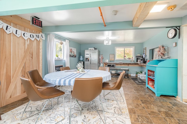 dining room featuring beam ceiling