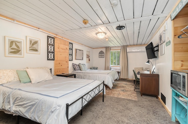 bedroom with carpet flooring and wood ceiling