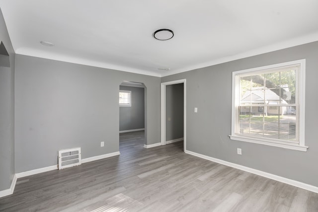 empty room with hardwood / wood-style flooring