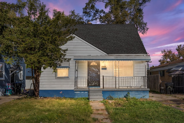 bungalow with a lawn and a porch