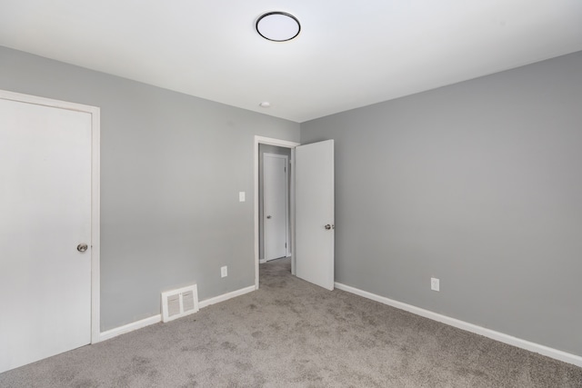 unfurnished bedroom with light carpet