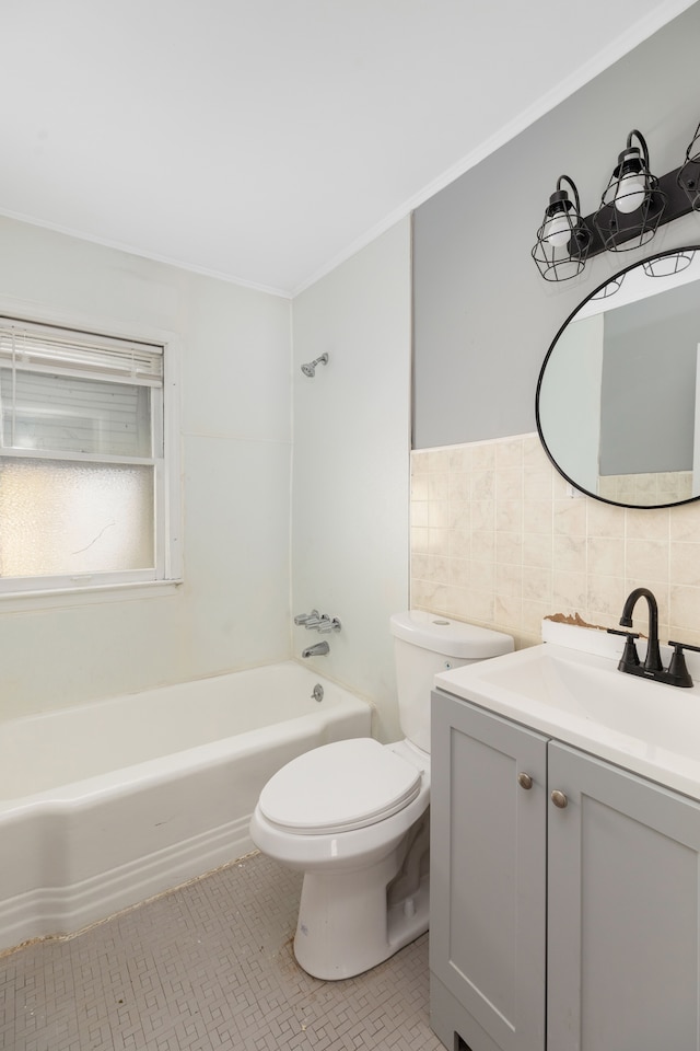 full bathroom with washtub / shower combination, backsplash, toilet, vanity, and tile walls