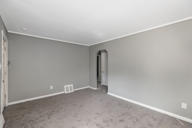 unfurnished room with carpet flooring and ornamental molding