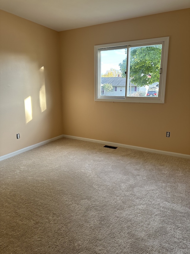 empty room featuring carpet flooring