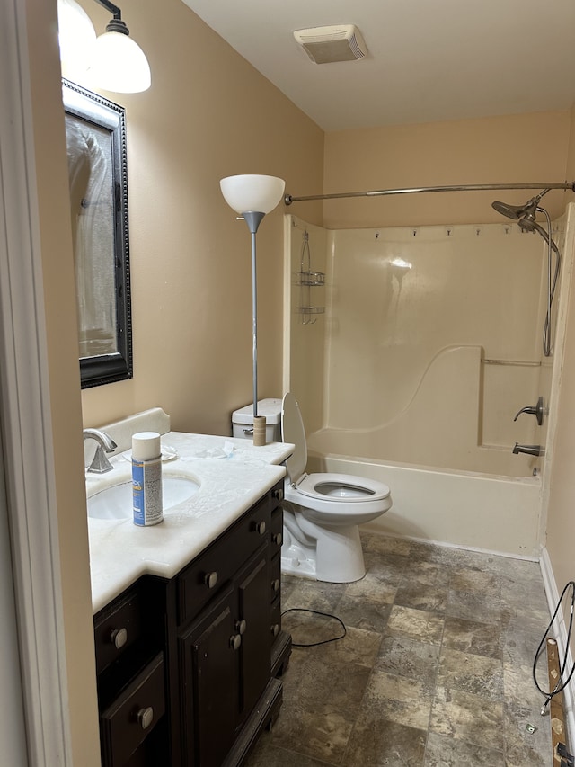 full bathroom featuring vanity, tub / shower combination, and toilet