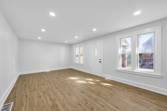 entryway with light hardwood / wood-style floors