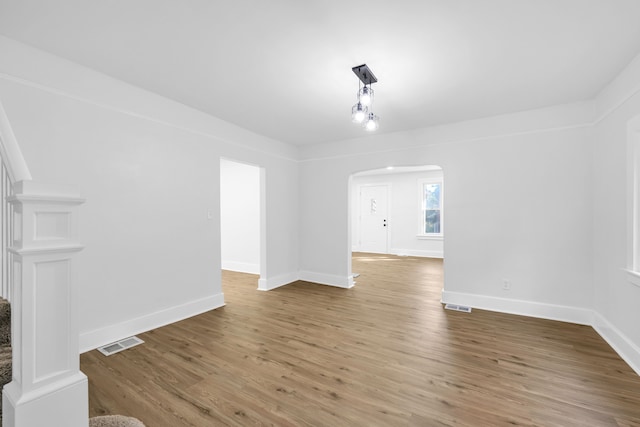 unfurnished living room with hardwood / wood-style flooring