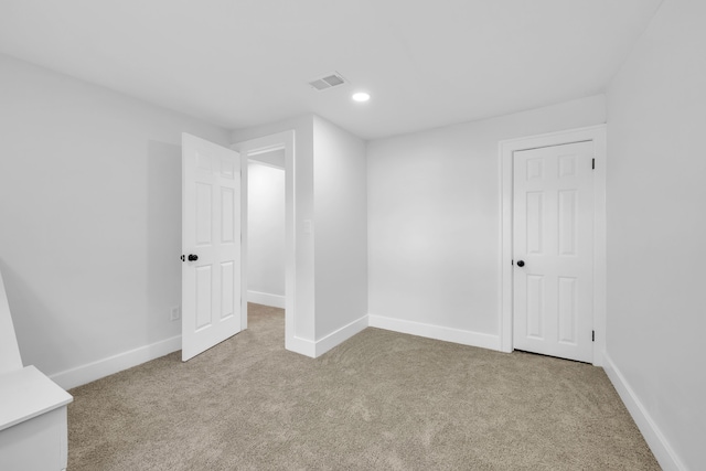 bonus room with light carpet