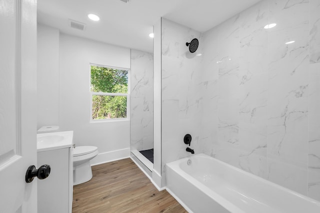 bathroom featuring wood-type flooring, vanity, and toilet