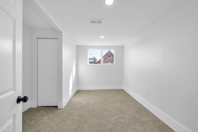 interior space featuring light colored carpet