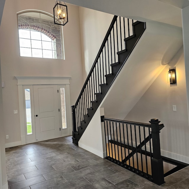 foyer entrance featuring a chandelier