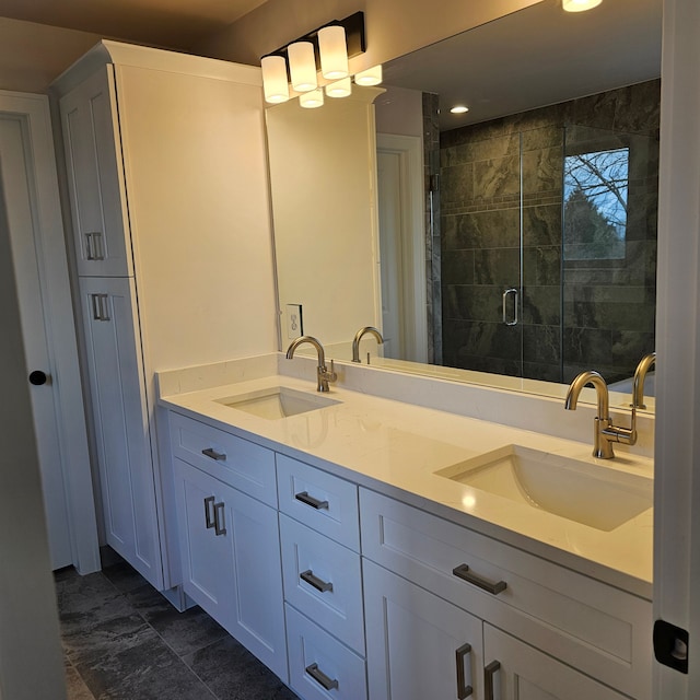 bathroom featuring walk in shower and vanity