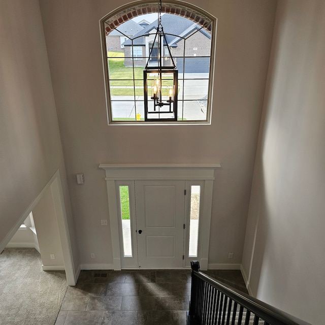 foyer with a chandelier