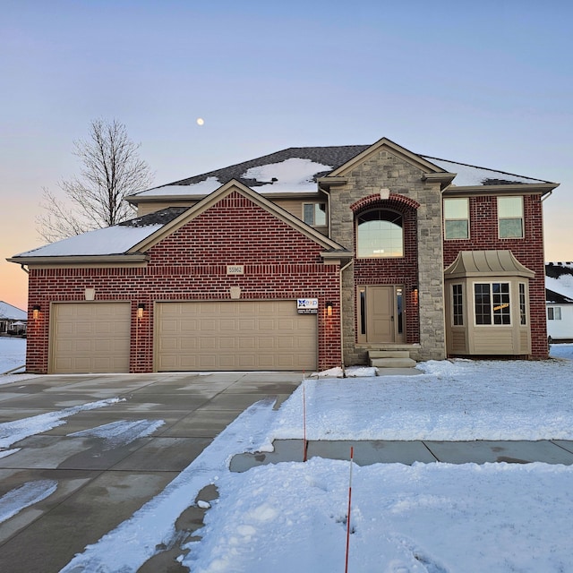 view of front of property with a garage