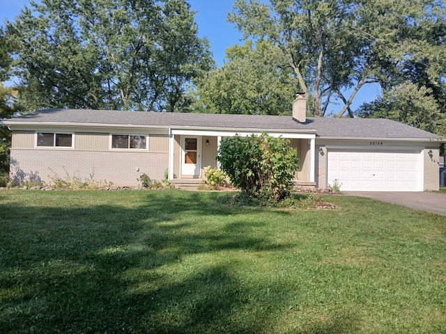 ranch-style house with a front yard and a garage