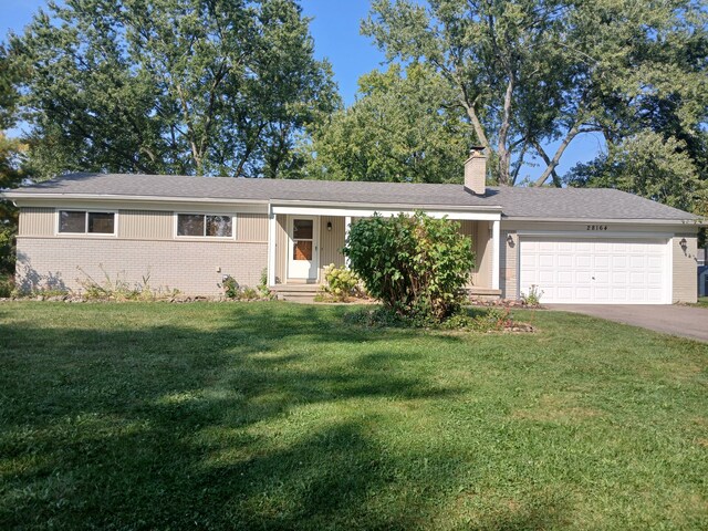 28164 Kendallwood Dr, Farmington Hills, MI 48334 - ranch-style home with brick siding, a chimney, a garage, a front lawn, and concrete driveway