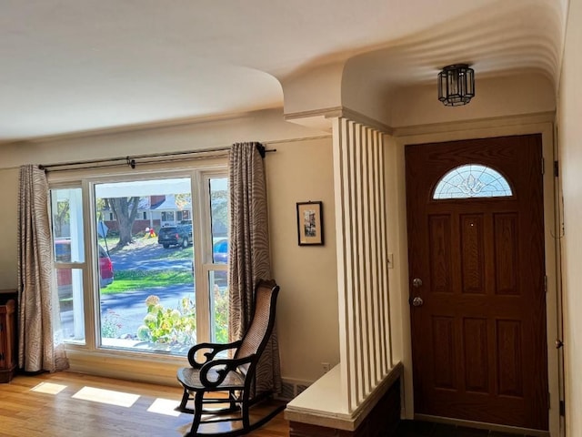 foyer entrance with plenty of natural light and light hardwood / wood-style flooring