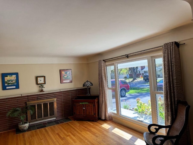 sitting room featuring wood-type flooring and a fireplace