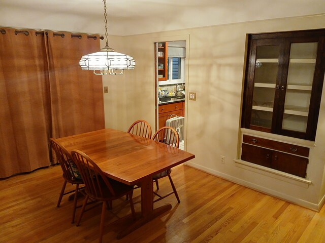 28164 Kendallwood Dr, Farmington Hills, MI 48334 - dining room featuring light wood-type flooring and baseboards