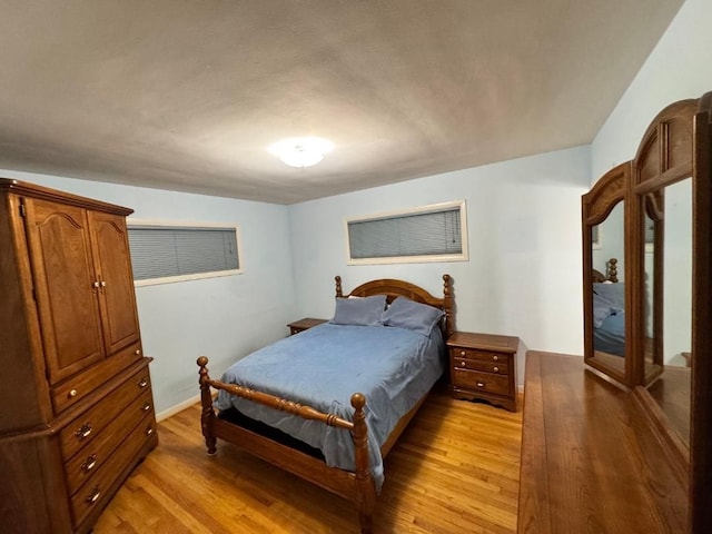 bedroom with light wood-type flooring