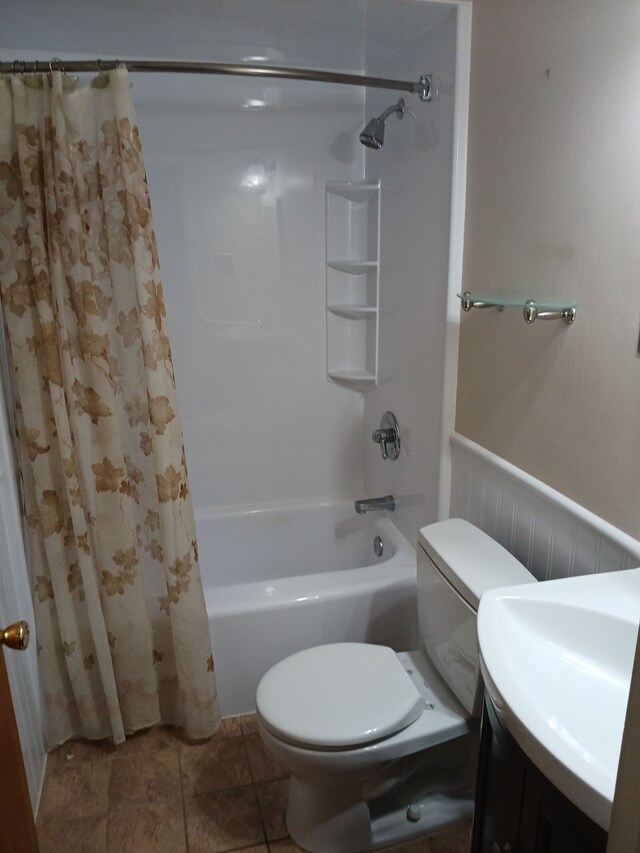 28164 Kendallwood Dr, Farmington Hills, MI 48334 - bathroom with shower / bath combo with shower curtain, toilet, a wainscoted wall, and vanity