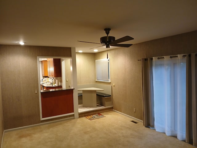 interior space featuring ceiling fan