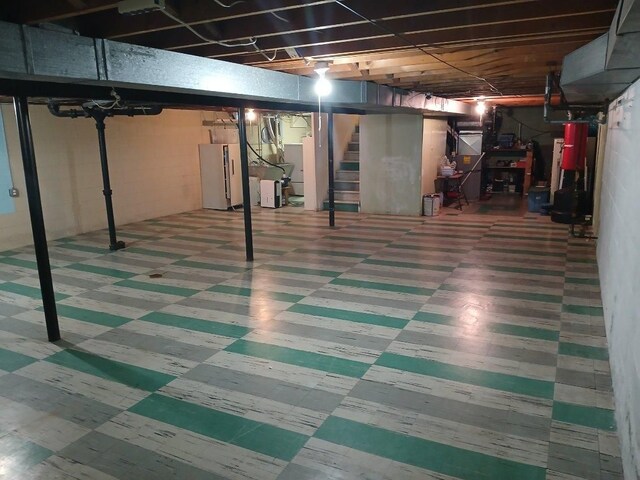 28164 Kendallwood Dr, Farmington Hills, MI 48334 - basement featuring tile patterned floors, stairs, and refrigerator