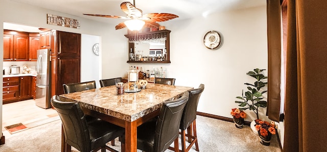 dining area with light carpet