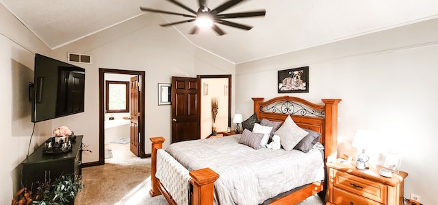 bedroom with ceiling fan, light carpet, high vaulted ceiling, and ensuite bath