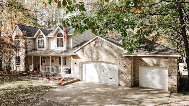 front facade featuring a porch and a garage