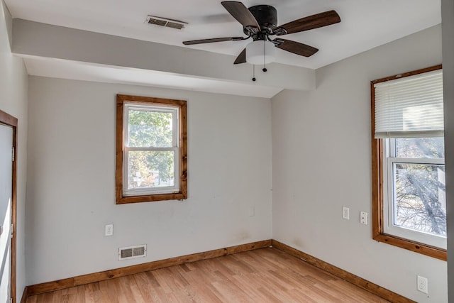 empty room with light hardwood / wood-style floors and ceiling fan