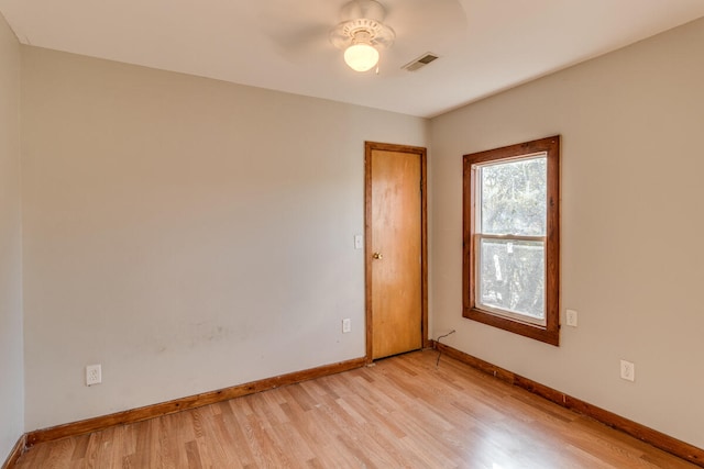 spare room with ceiling fan and light hardwood / wood-style floors