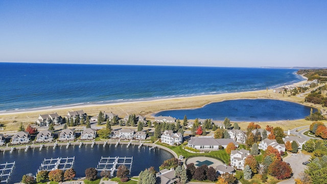 aerial view featuring a water view and a beach view