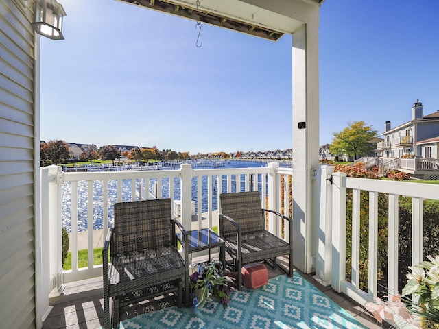 balcony featuring a water view