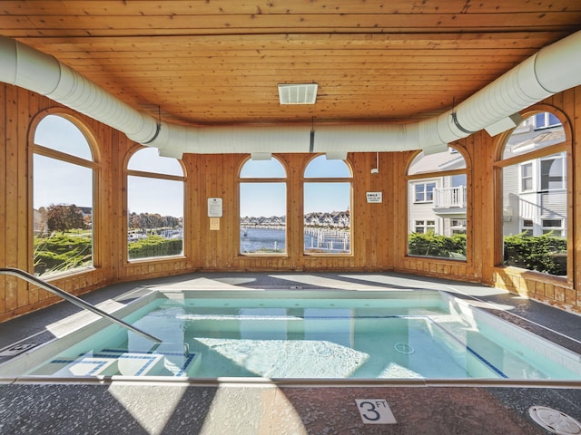 view of swimming pool featuring an indoor in ground hot tub