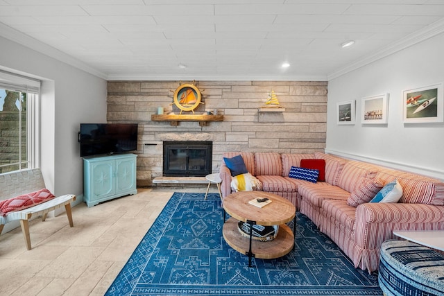 living area with recessed lighting, a stone fireplace, and crown molding