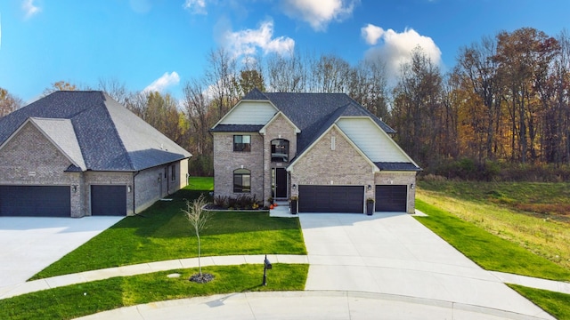 view of front of house featuring a front yard and a garage