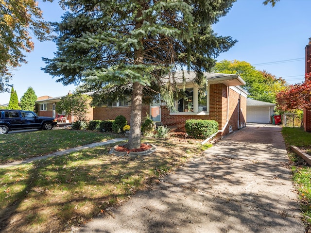 view of front facade with a garage and a front lawn