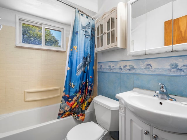 full bathroom featuring vanity, toilet, tile walls, and shower / tub combo