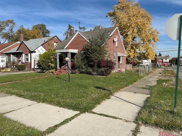 bungalow-style house with a front yard