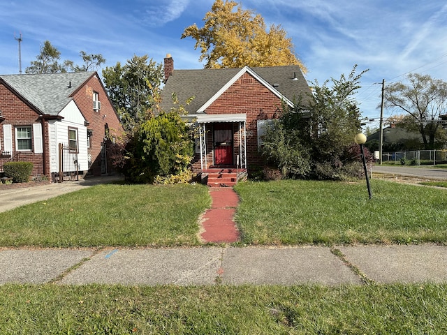 bungalow-style house featuring a front yard