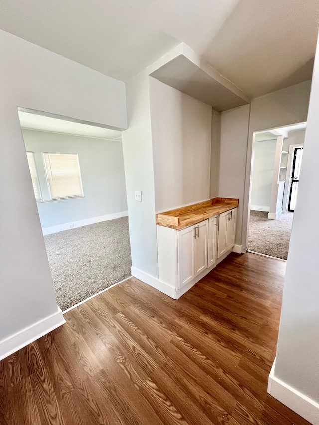 hall with wood-type flooring