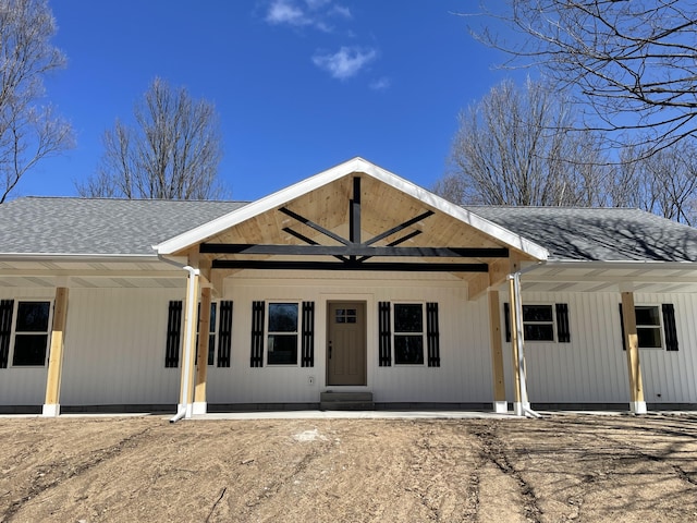 2412 W Garfield, New Era, MI 49446 - view of front of home featuring a shingled roof and covered porch