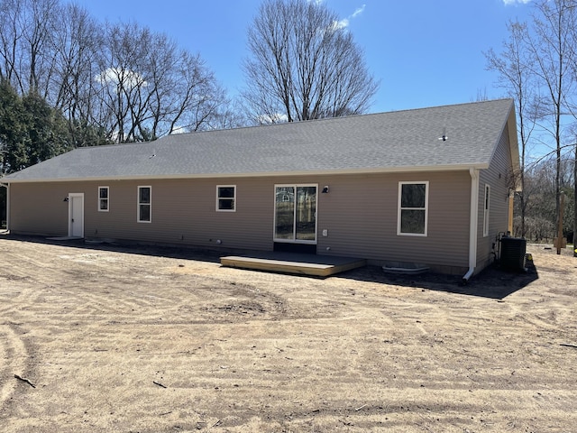 2412 W Garfield, New Era, MI 49446 - back of house featuring roof with shingles, central AC unit, and a wooden deck